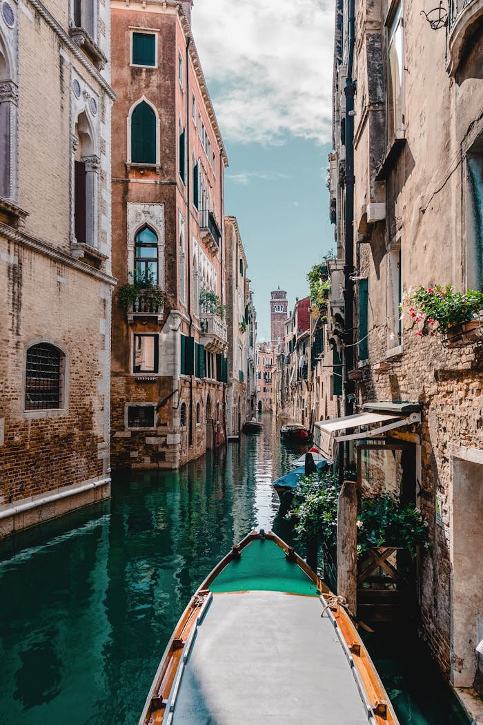 client-satisfaction-img Captivating view of a traditional Venetian canal surrounded by historic buildings, perfect for travel enthusiasts.